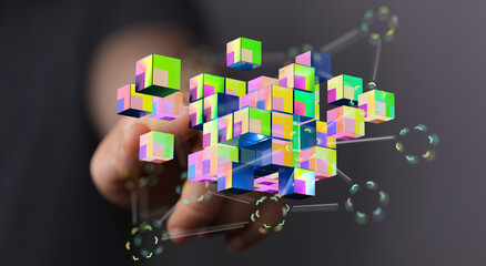 Digitally rendered image of a hand interacting with a colorful 3D cube data connection concept.