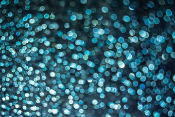 Soft focus image of bokeh effect over grass. the background at night time for overlay design, suitable for text and layout purposes