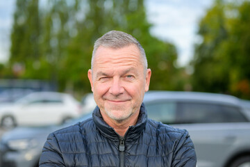 Mature Man Winking Outdoors Playfully