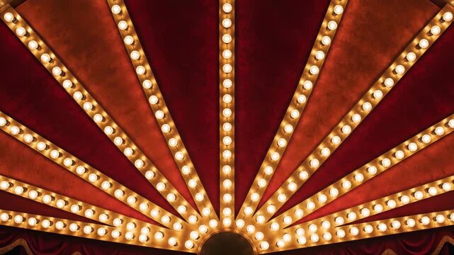 Vintage marquee light bulb pattern with glowing warm light on red and orange velvet curtain background