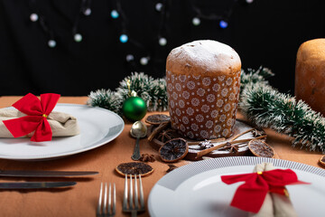Panettone served on a table with Christmas decorations.