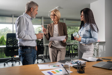 People chatting during business meeting break