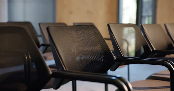 Chairs, business and empty conference hall for event, forum or workshop with meeting venue. Seats, room and interior at convention center with rows for summit, trade show and furniture for seminar