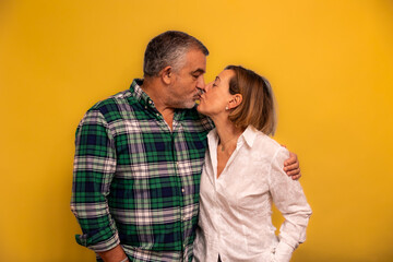 Senior couple kissing, showing love and affection