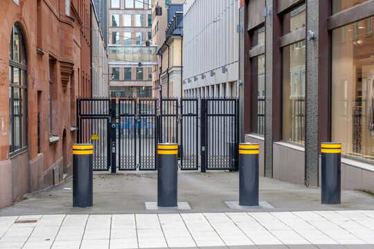 Urban Alleyway with Bollards and Secure Gates