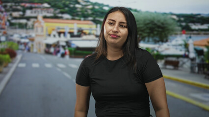 Woman shrugging with hands raised on a street, eyes closed and mouth slightly open; resignation waiting.