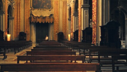 Ornate church captured in soft defocused bokeh, rows of wooden pews and gilded columns receding toward a distant altar  background backdrop copyspace calm. © Krakenimages.com
