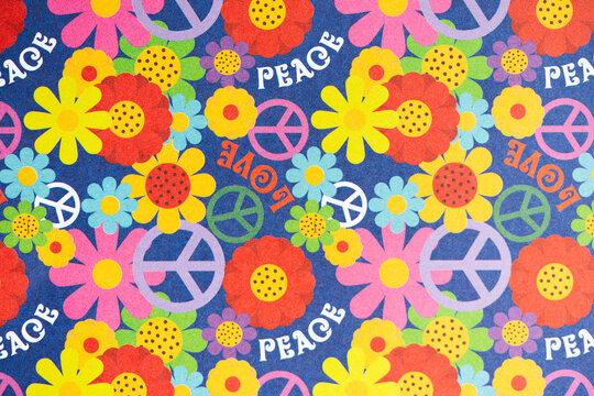 Retro Flower Power Background, Seamless Wallpaper Design with Psychedelic Colors, Vibrant 1960s Hippie Floral Pattern with Peace Signs and Love Text Background