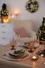 Festive table setting with Christmas decor indoors, closeup