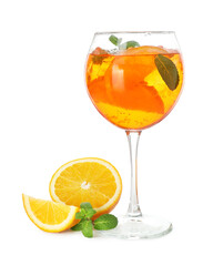 Glass of refreshing spritzer cocktail with mint and orange slices isolated on white