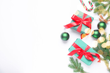 Wrapped Christmas gifts and decor on white background, flat lay. Space for text
