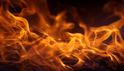Fototapeta premium A closeup view of vibrant orange and yellow flames, creating a mesmerizing visual effect. The flames appear to be in motion.