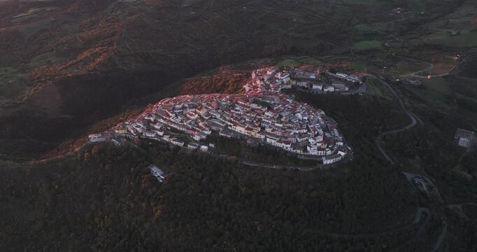 Aerial view of Rotondella, a town perched on a hill, showcasing its unique layout and the surrounding landscape, Rotondella, Basilicata, Italy.