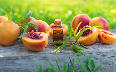 Peach kernel oil and supplements. Selective focus.