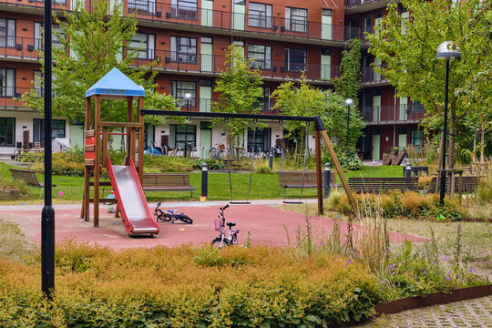 Modern Playground In Hyllie Malm Sweden With Slide Swings And Bicycles Near Residential Buildings And Greenery In Urban Landscape