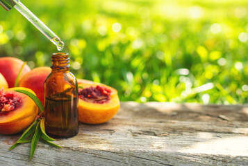 Peach kernel oil and supplements. Selective focus.