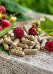 Raspberry leaf extract and supplements. Selective focus.