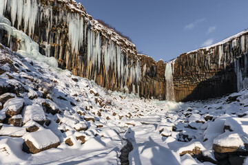 Frozen winter view of Sfartifoss waterfall, Iceland.