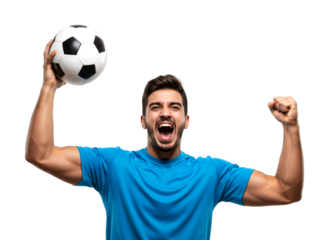 Young man enthusiastically cheers, holding a soccer ball high in one hand and raising his other fist in a triumphant gesture, celebrating a goal or victory.