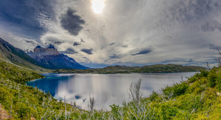 Torres del Paine in Chile captured with dramatic granite peaks, pristine lakes, rugged Patagonian landscape, natural wilderness scenery, iconic travel destination and majestic mountain panorama views.