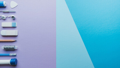Stationery essentials arranged on a dual-tone background, ideal for creative projects and design layouts