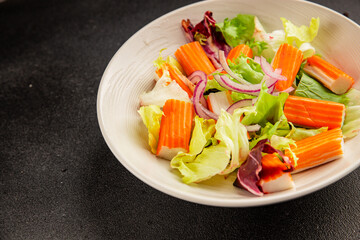 Crab sticks salad green salad leaves healthy food appetizer fresh gourmet food table setting rustic food top view copy space keto and paleo diet