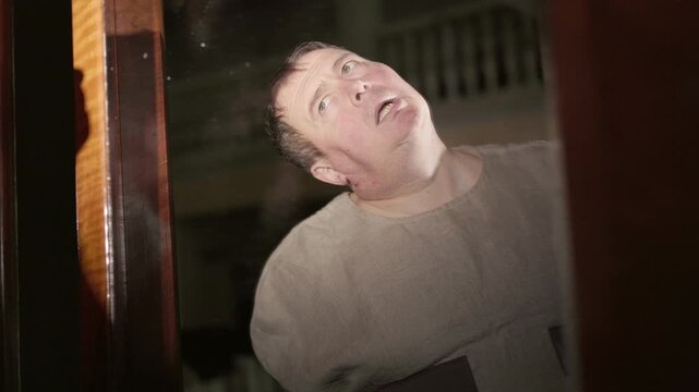 Mentally ill alcoholic person. Straight jacket on the man.