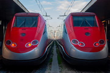 Two high-speed train waiting for passengers