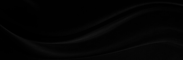 Black gray satin dark fabric texture luxurious shiny that is abstract silk cloth panorama background with patterns soft waves blur beautiful.