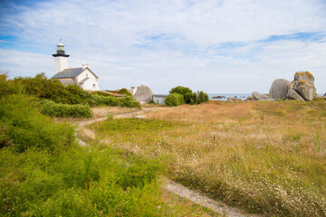 The Pontusval Lighthouse is a historic and picturesque lighthouse located in Brittany, France. View in its stunning natural setting on a sunny day,