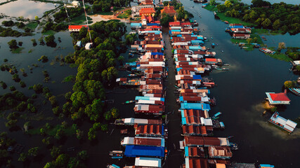 Kampong Phluk floating village with stilt houses on Tonle Sap lake in Cambodia.