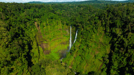 Zipline flights. Tad Fane waterfall in rainforest at Pakse and Champasak city Laos. Tour tourism and travel in Asia.