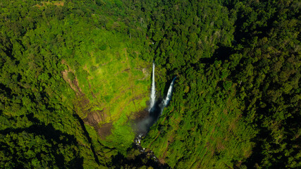 Zipline flights. Tad Fane waterfall in rainforest at Pakse and Champasak city Laos. Tour tourism and travel in Asia.