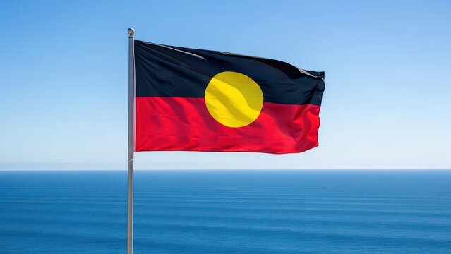 Australian Aboriginal Flag Waving Over the Ocean