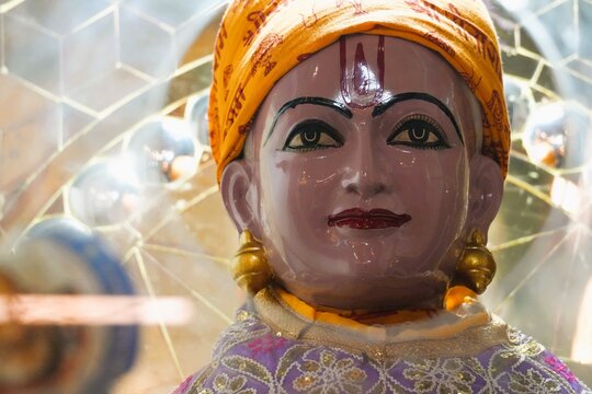 Close-Up Face of Sant Tulsidas Statue with Traditional Hindu Spiritual Background