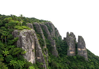 Lush green tropical mountain cliffs rise majestically, adorned with dense jungle foliage and towering palm trees under a dramatic sky.