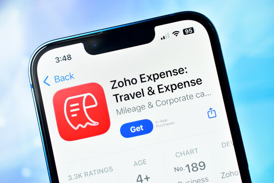 Closeup of zoho expense travel expense management app listing on smartphone screen