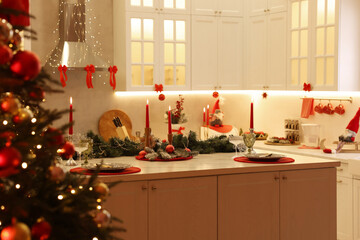 Christmas decor and tableware on countertop in kitchen. Interior design