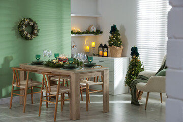 Festive table setting with Christmas decor indoors