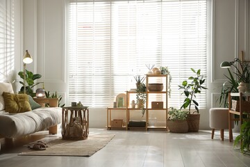 Stylish living room with sofa and houseplants. Interior design