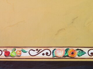 traditional mexican handmade art on a wall with local fruits, plants