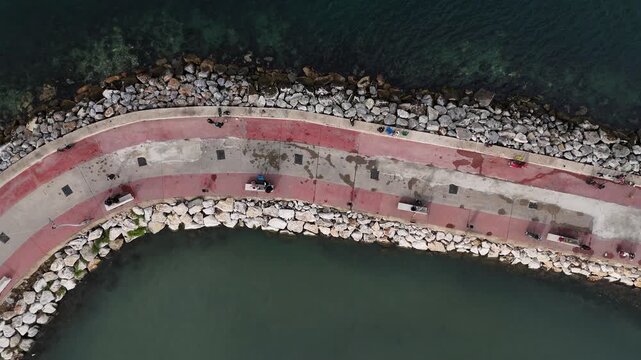 A water bay with calm waters extending into the land, creating a natural coastal formation. The scene reflects tranquility, open horizons, and a harmonious connection between sea and shore, making it 