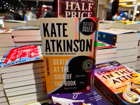 Bookstore display featuring Kate Atkinson novel amid a stack of colorful bestsellers