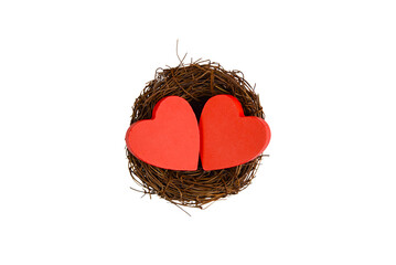 handcrafted red hearts in straw nest arrangement, decorative paper cutouts capturing romantic seasonal ambiance