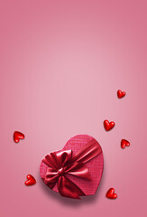 Red gift box with red ribbon on the pink background. Passion present. Happy Valentine Day.