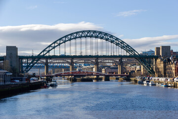 River Tyne and its famous bridges with the busy quayside market on a sunny afternoon