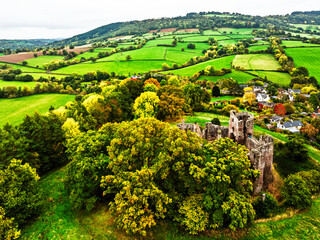 Obraz premium Autumn Colours over ruins of Grosmont Castle from a drone, Grosmont, Monmouthshire, Wales, UK 