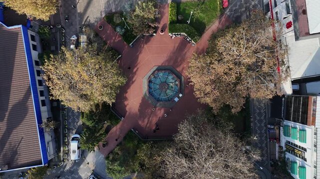 
Footage of a garden square featuring green trees, plants, and open space designed for relaxation and outdoor activities. The scene represents nature, public parks, urban landscaping, and peaceful env