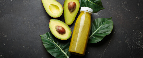 Avocado smoothie fresh fruit halves dark background healthy drink diet nutrition