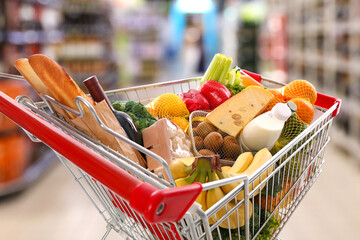 Shopping cart full of products in supermarket